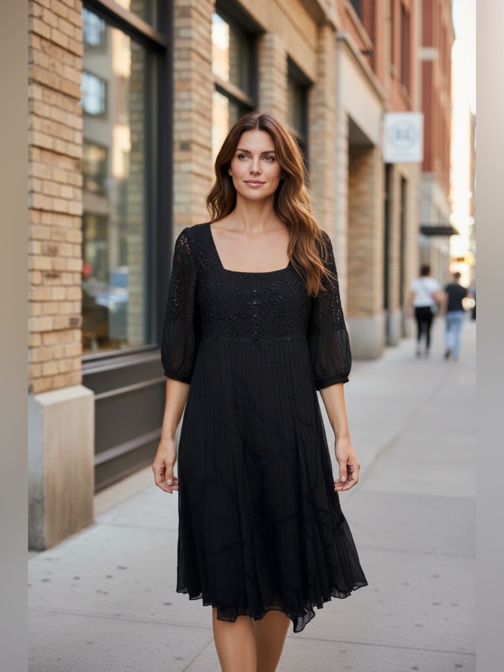1. Komarov Black Midi Dress with Textured Bodice